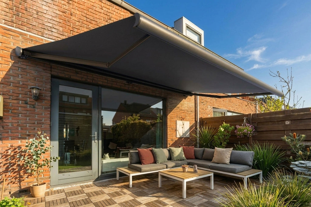 Awning shading an outdoor lounge on a brick home